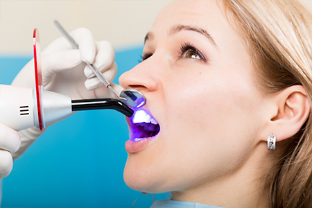 Patient receiving dental bonding treatment
